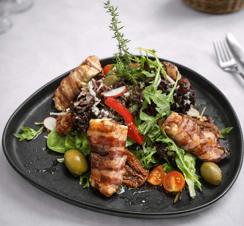 two glass of iced tea with some orange fruit around them