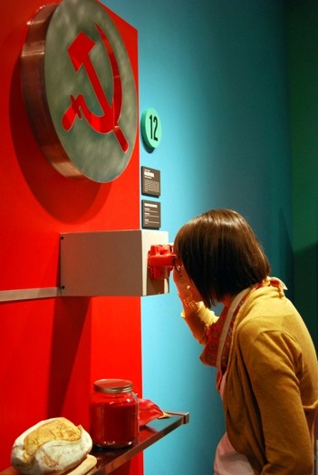 a woman is looking trough a device like a binocular