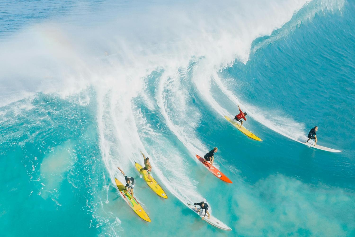 Surfers riding ocean waves – best-beginner-surf-spots-around-the-world
