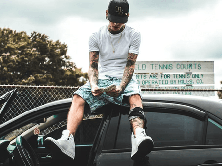 a student sitting on the edge of his chair in his student table