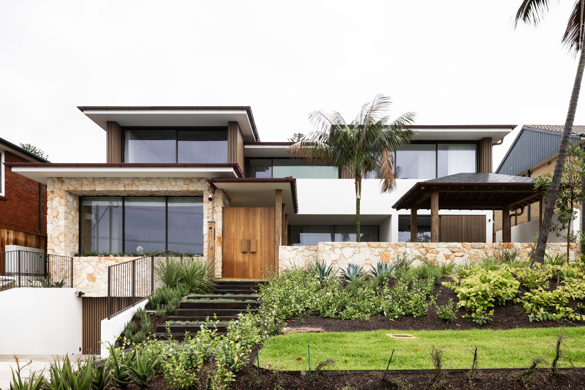 Modern brick and glass building reflecting the blue sky, with pedestrians and cyclists moving through a sunlit urban plaza, creating dynamic motion blur effects.