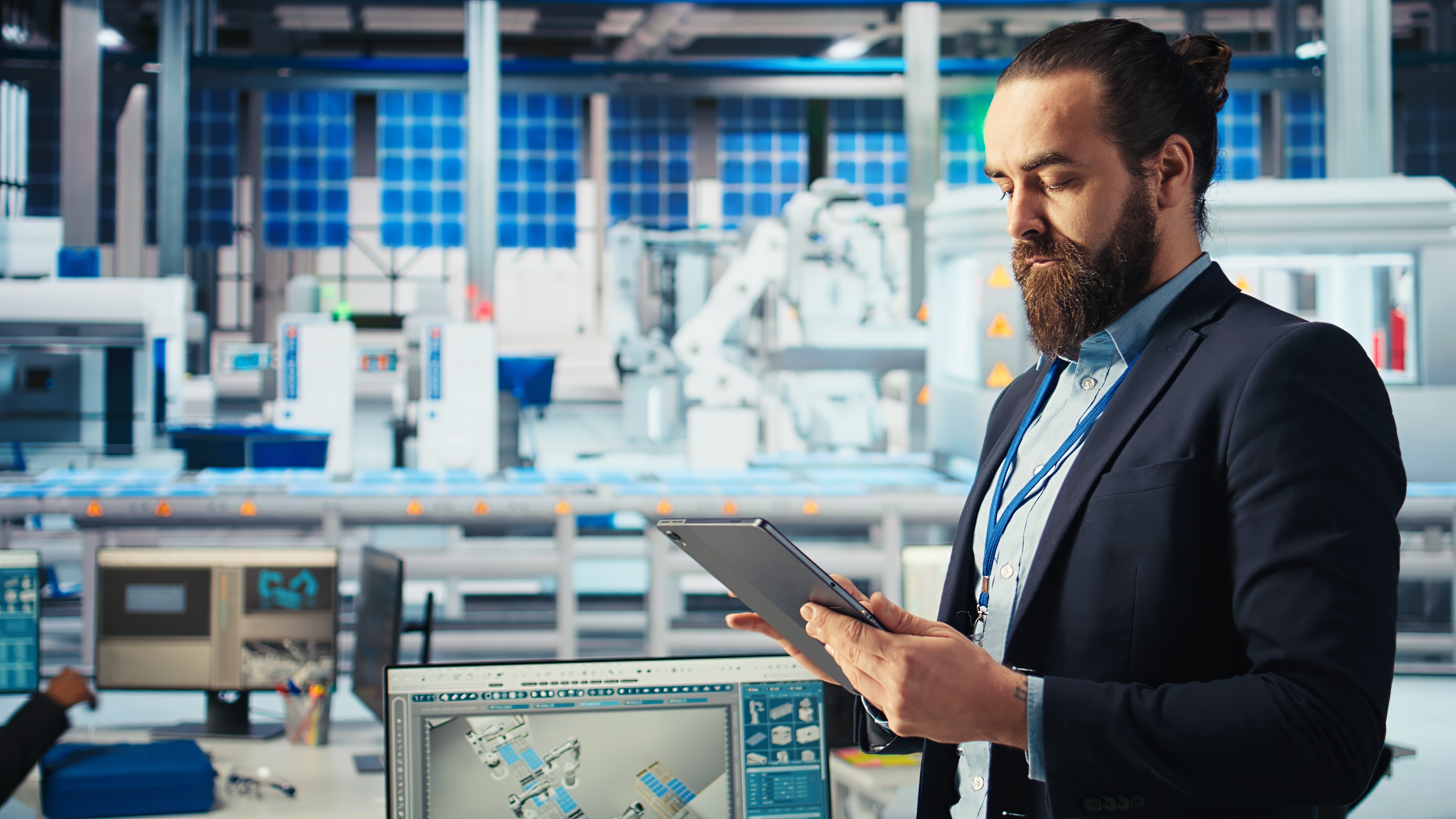 Manufacturing executive reviewing reporting systems and analytics for manufacturing marketing and digital marketing for manufacturers.
