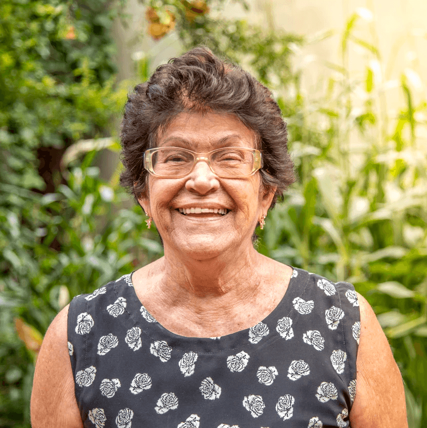 an older woman with white hair and a smile