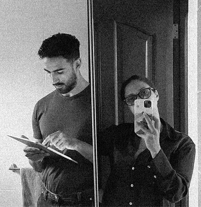 a blurry photo of a person standing in front of a wall