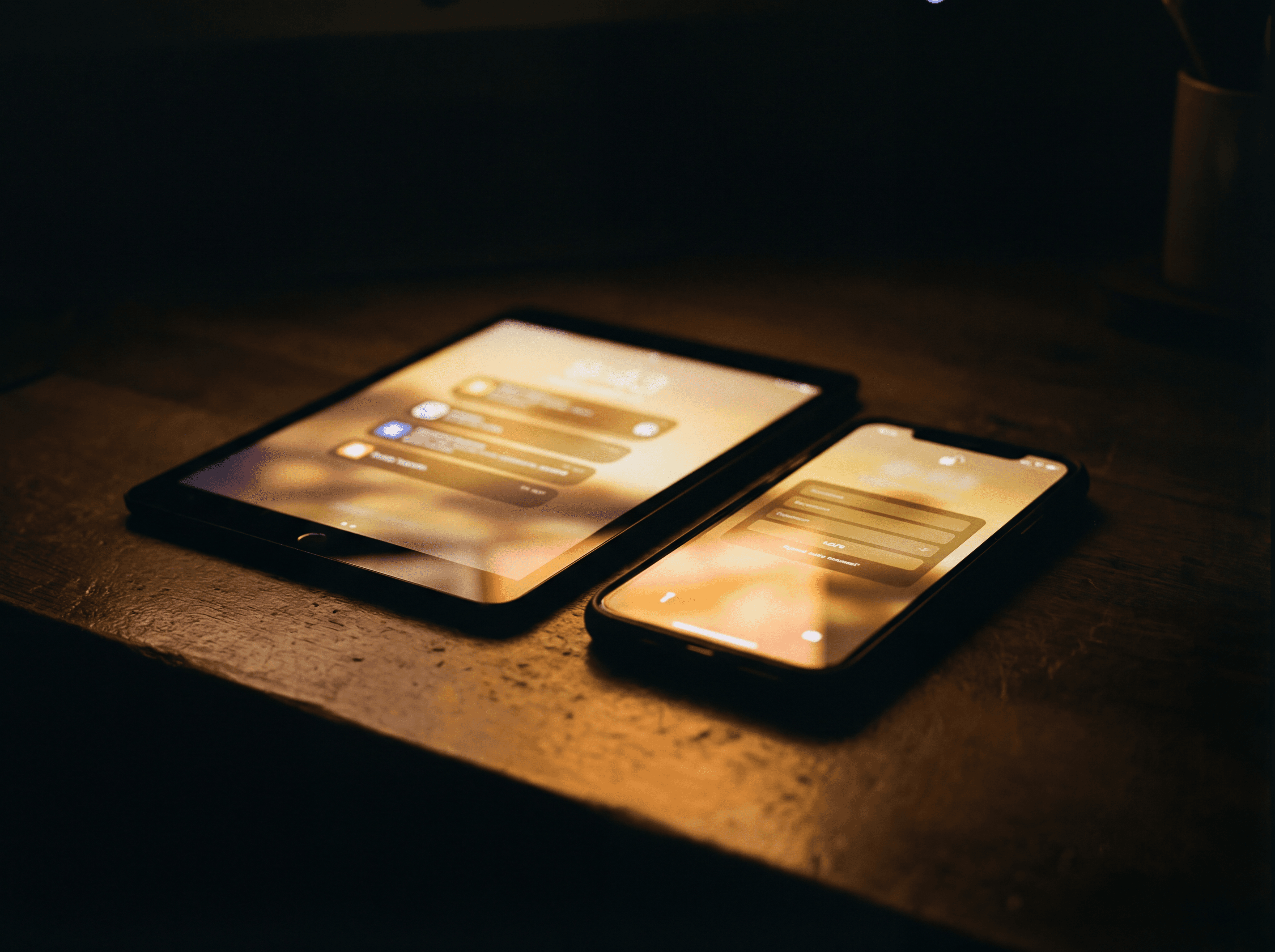 Laptop on a clean desk next to modern decor.