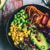 Variety of minimally processed plant foods representing a plant-forward eating pattern rich in fiber, vitamins, and polyphenols.