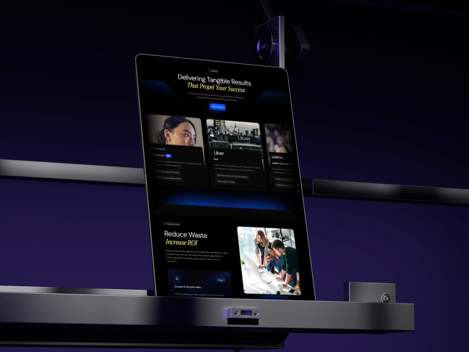 Dark-themed digital interface showing a website or application displayed across multiple devices against a black background.