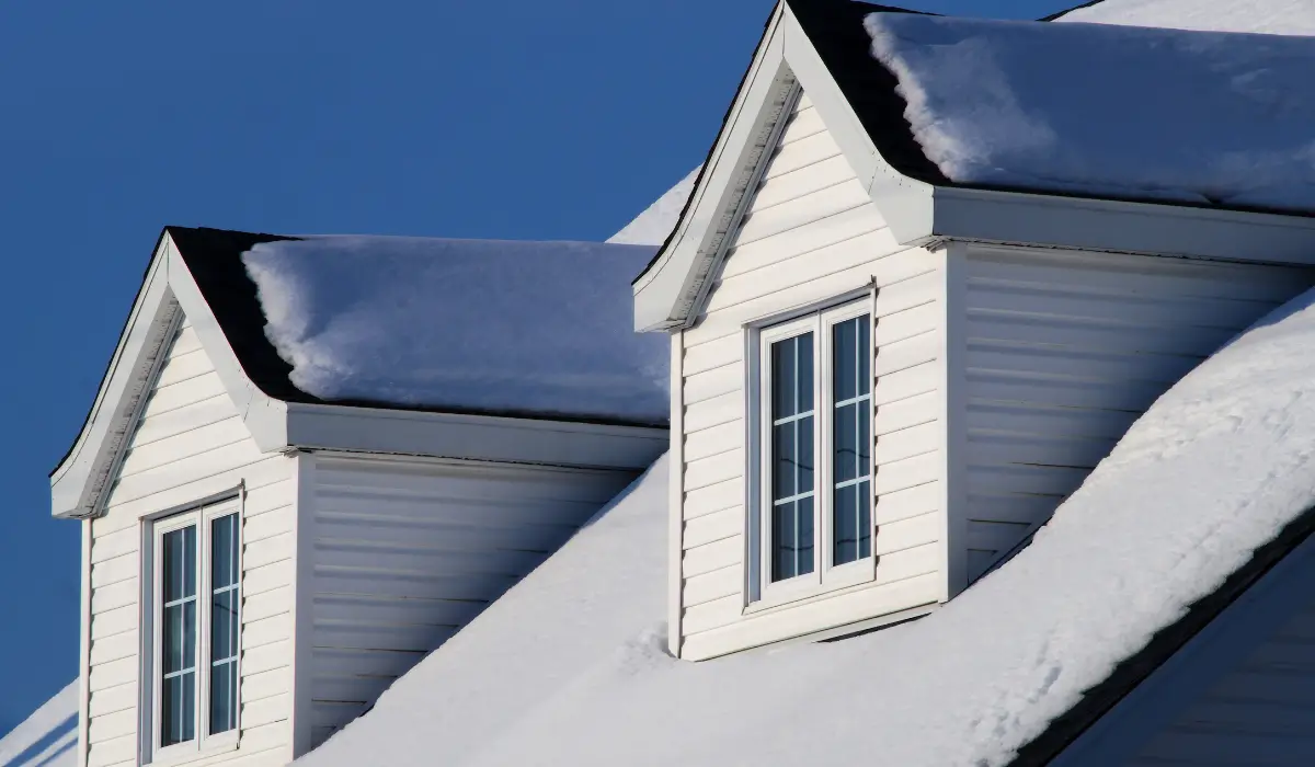 Winter snow accumulation on Naperville home rooftop signals risk of structural roof emergency and collapse.