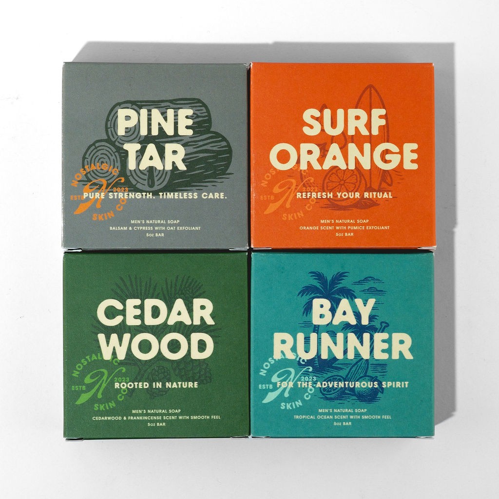 Stacked soap packaging for Pine Tar, Surf Orange, Cedar Wood, and Bay Runner