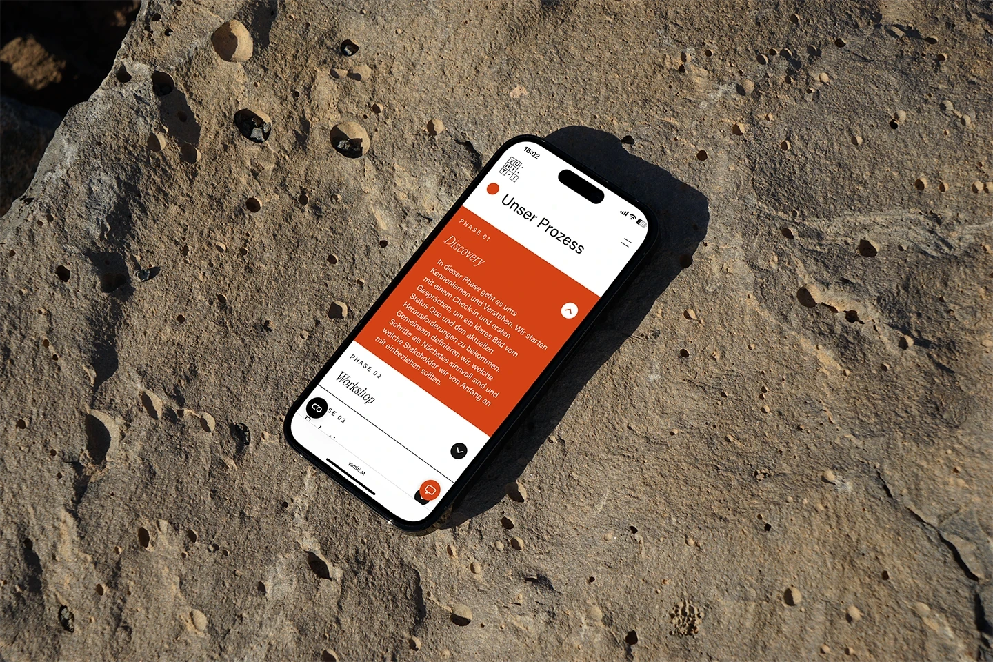 Yuniti Showcase Phone on stones