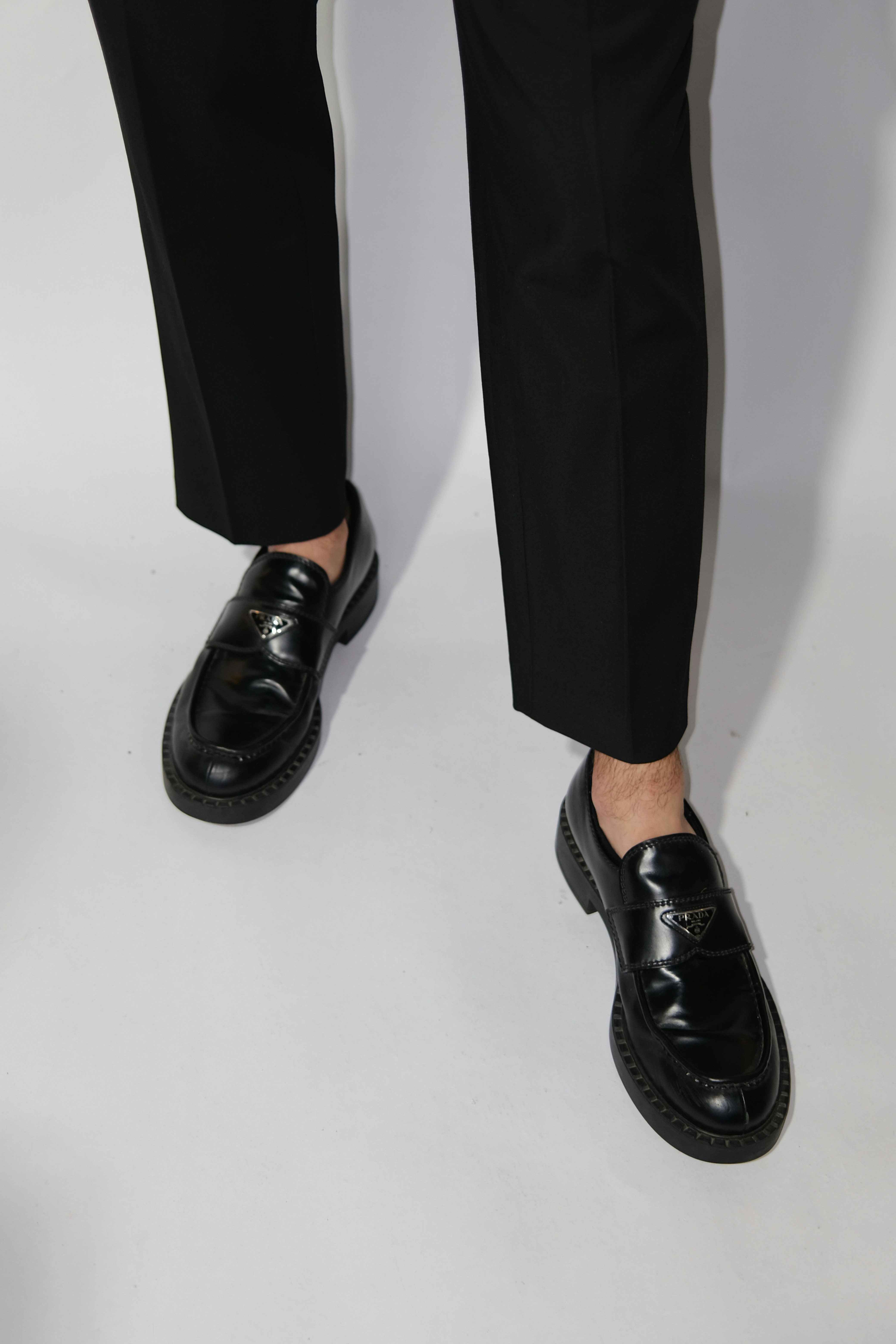 Black loafers with white background