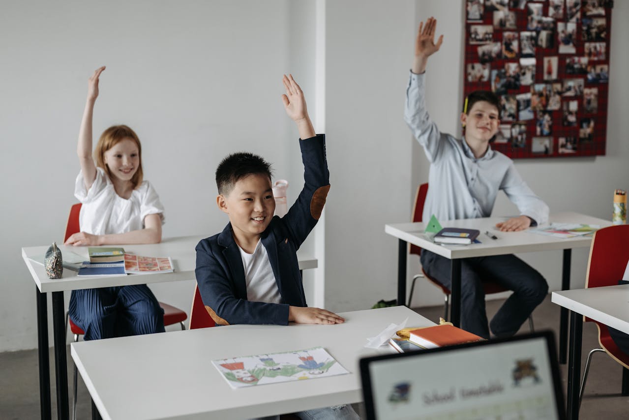 Singapore tuition centre, kids raise hand