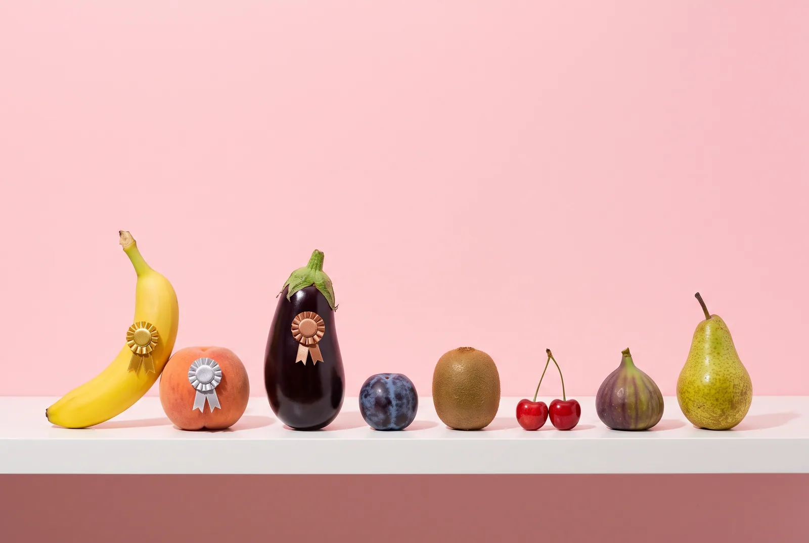 Eight fruits lined up on a shelf with gold, silver and bronze rosettes, the best porn accountability apps reviewed