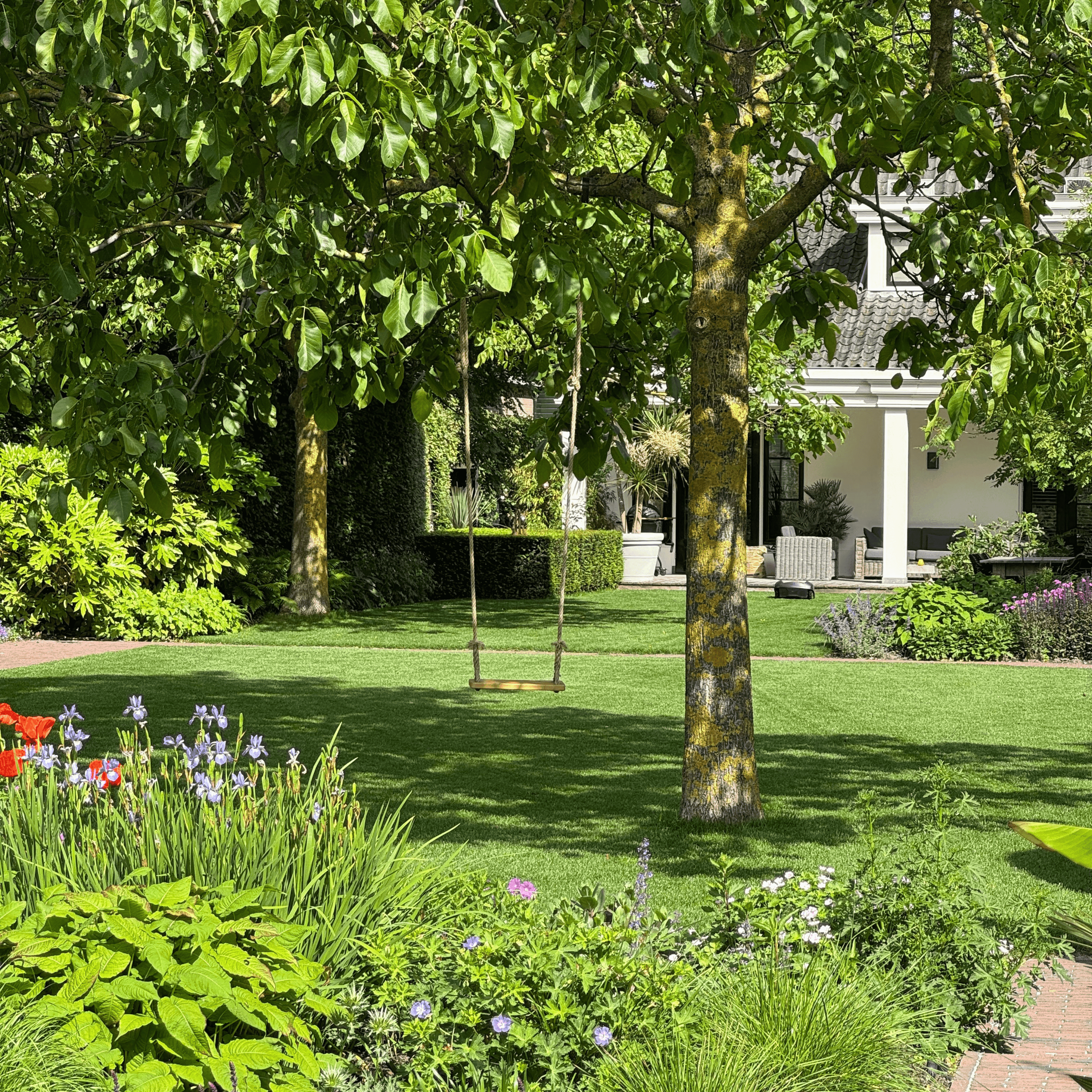 Modern interior with a minimalist design featuring curved rust-colored metal partitions, polished concrete floor, and subdued lighting, creating a warm, industrial ambiance.
