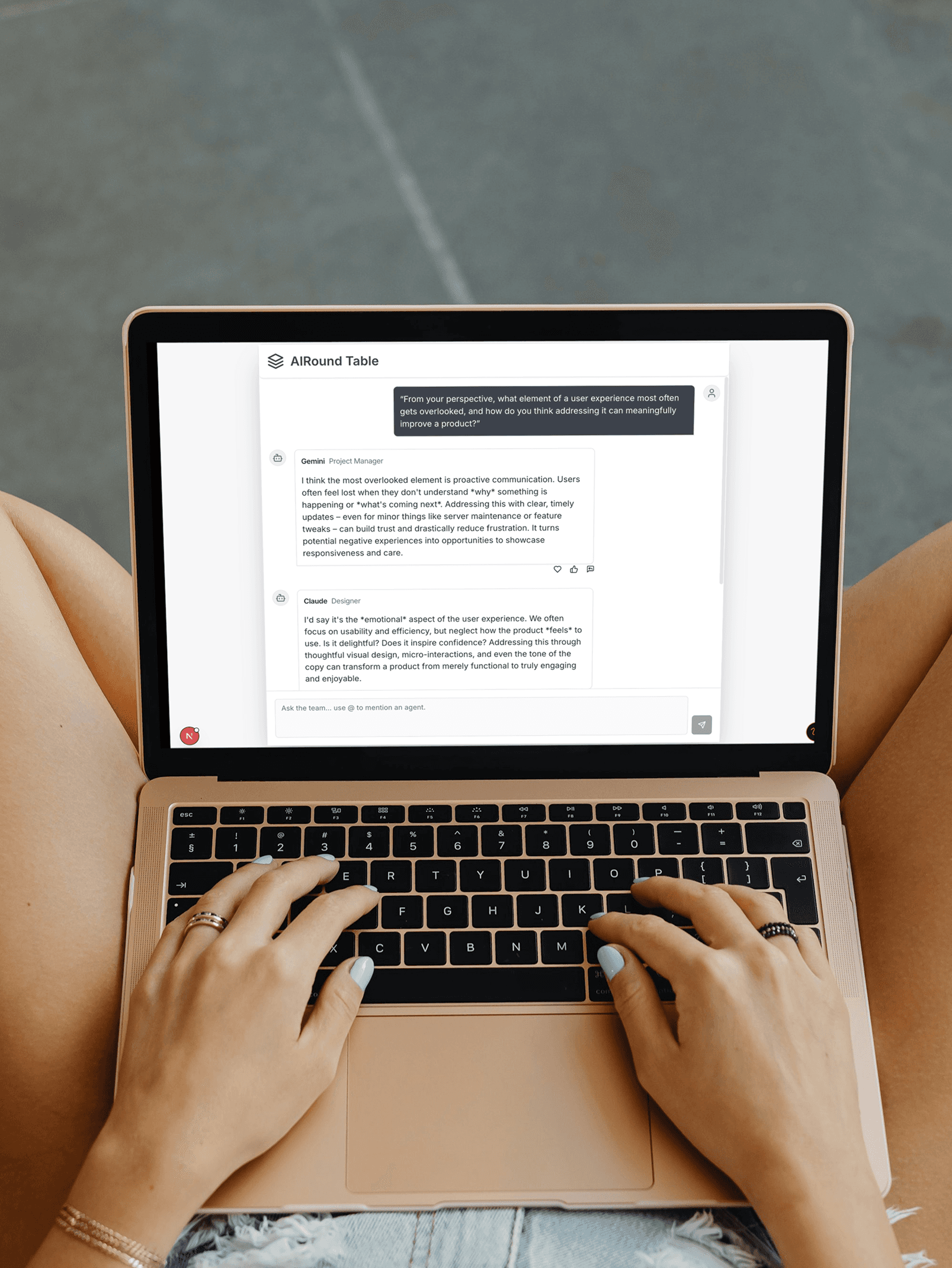 Typing in AI Roundtable discussion on laptop