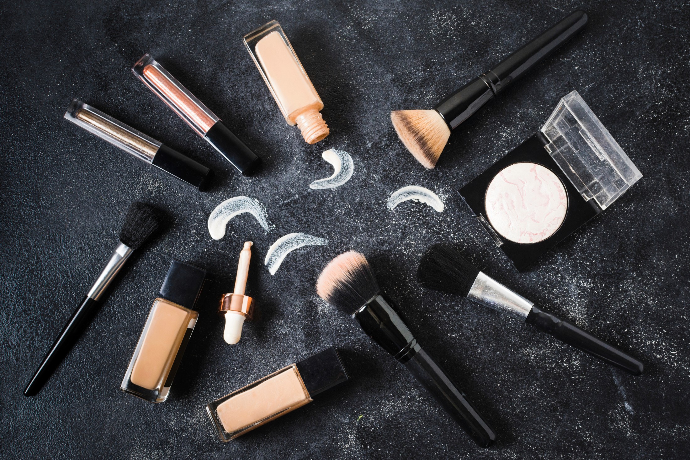 makup tools with brushes and foundation