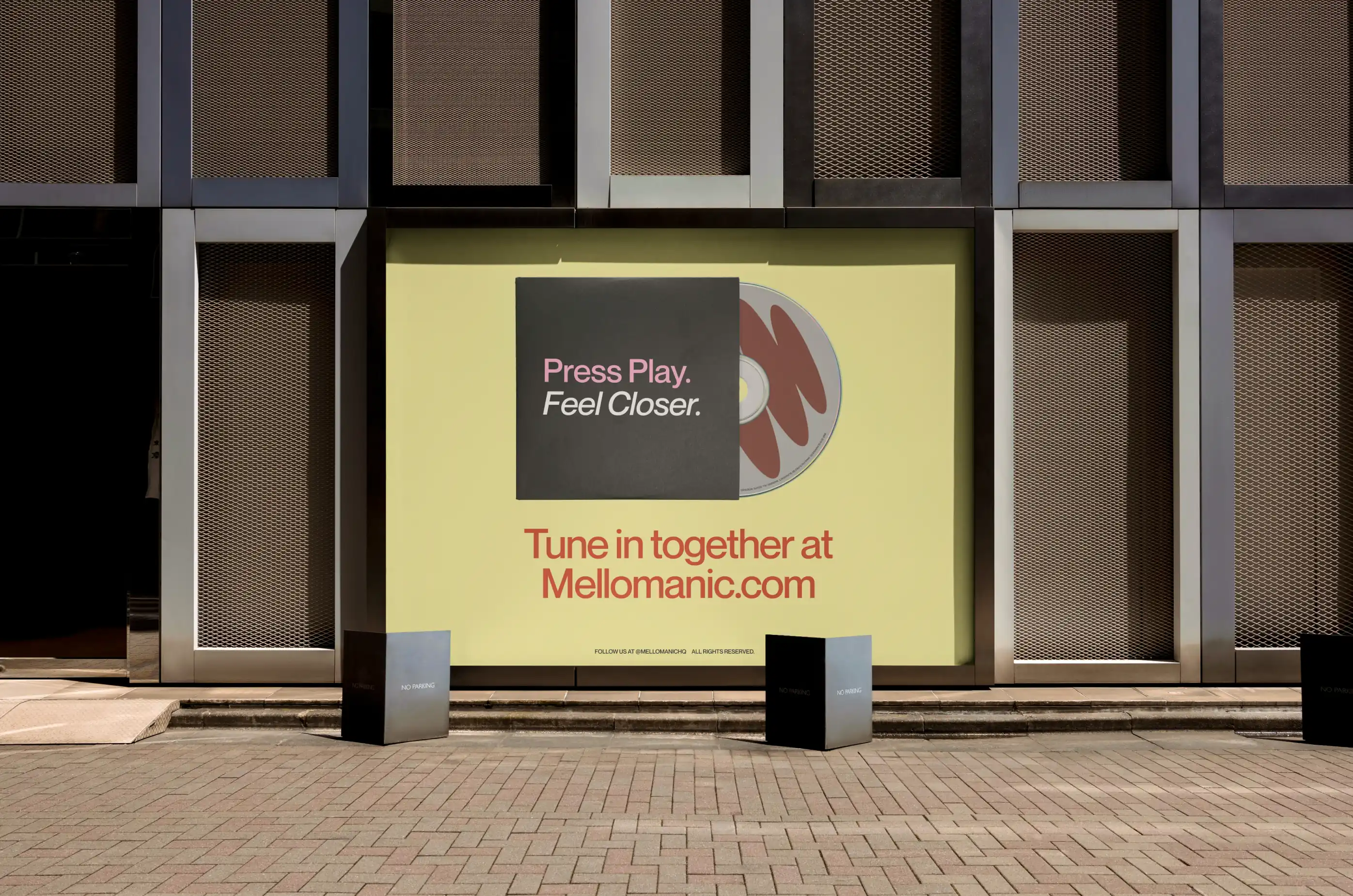 Mellomanic — Oversized wall advertisement in city setting — Campaign branding