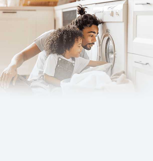 Parent's hands around a newborn baby