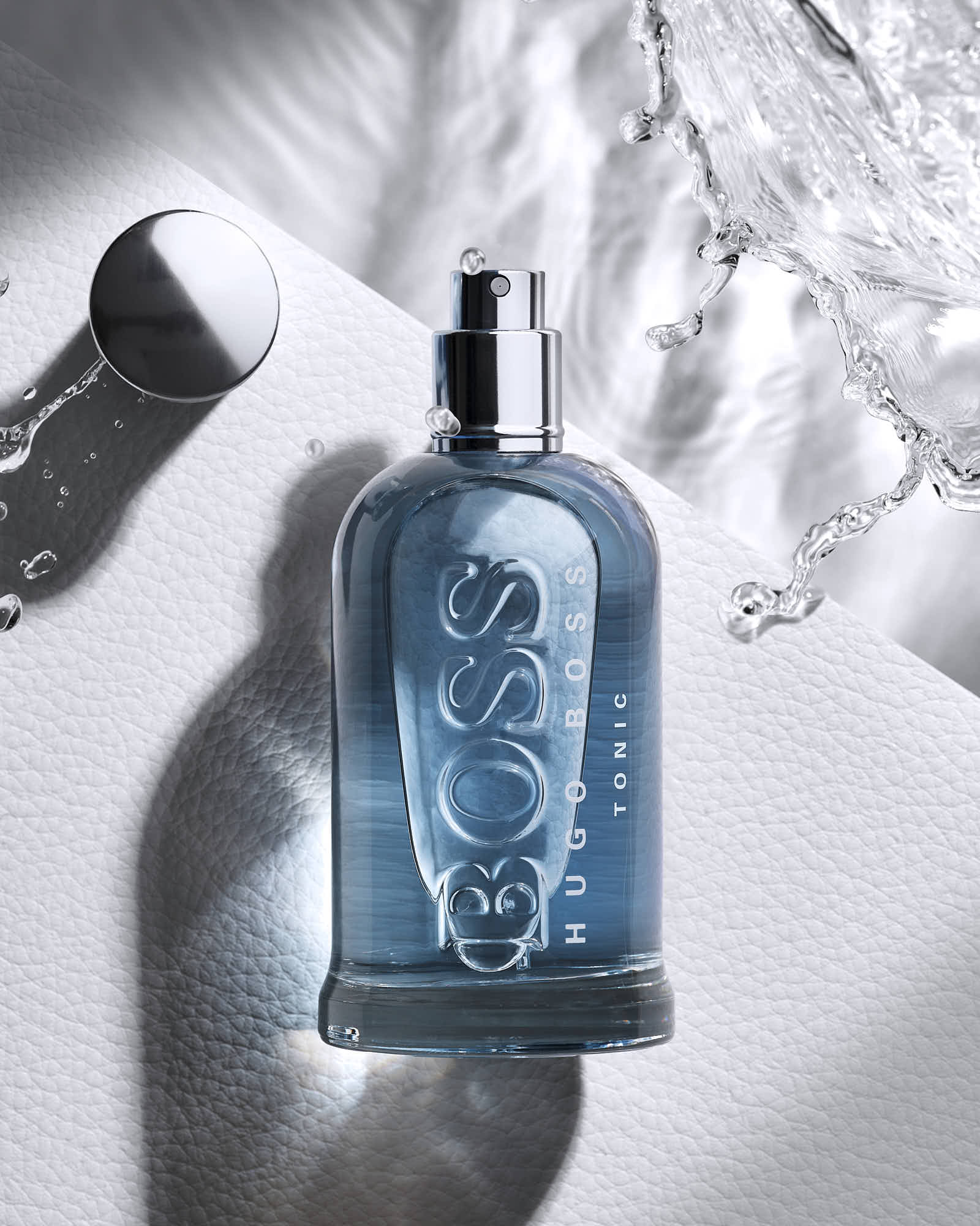 Hugo Boss Bottled Tonic Eau de Toilette with water splash background.