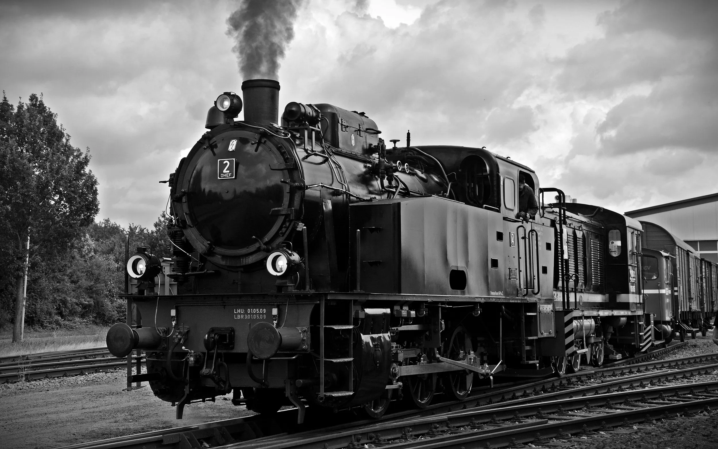 Vintage black steam locomotive at railway station, classic train travel and industrial heritage