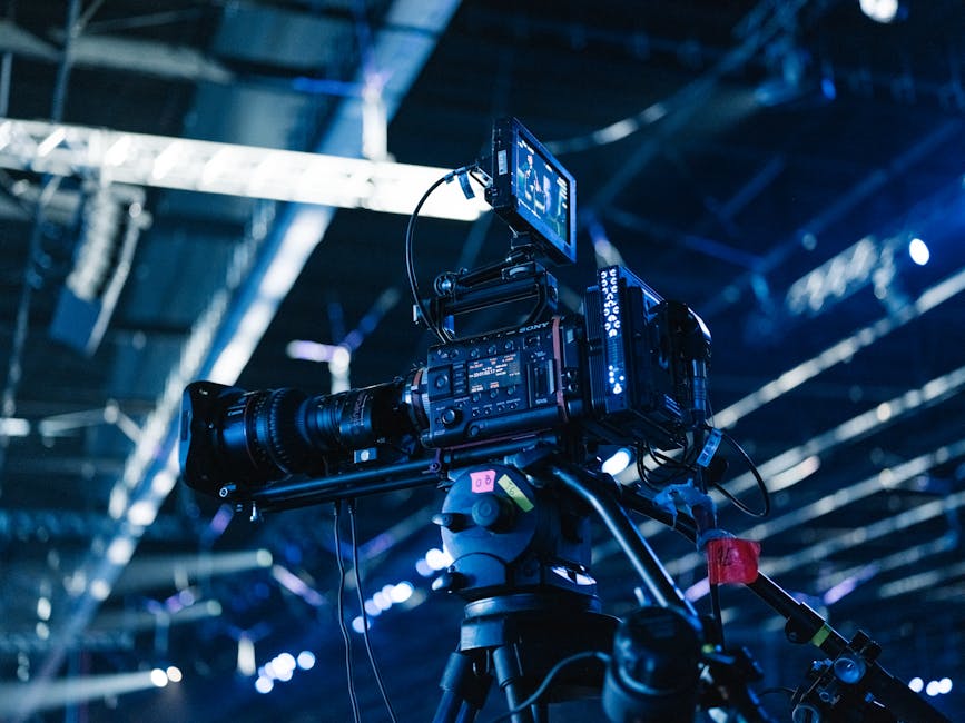 multi-camera setup with professional lighting in a large conference ballroom - conference videographer