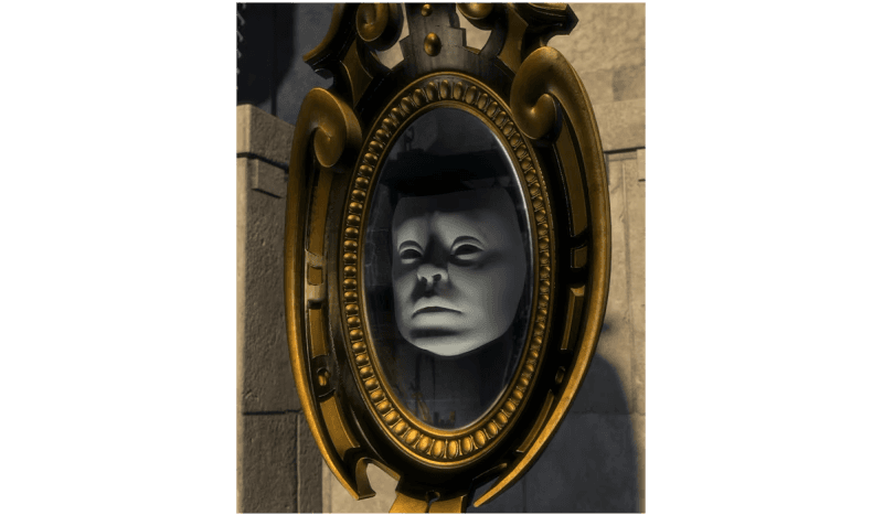 Face in ornate mirror