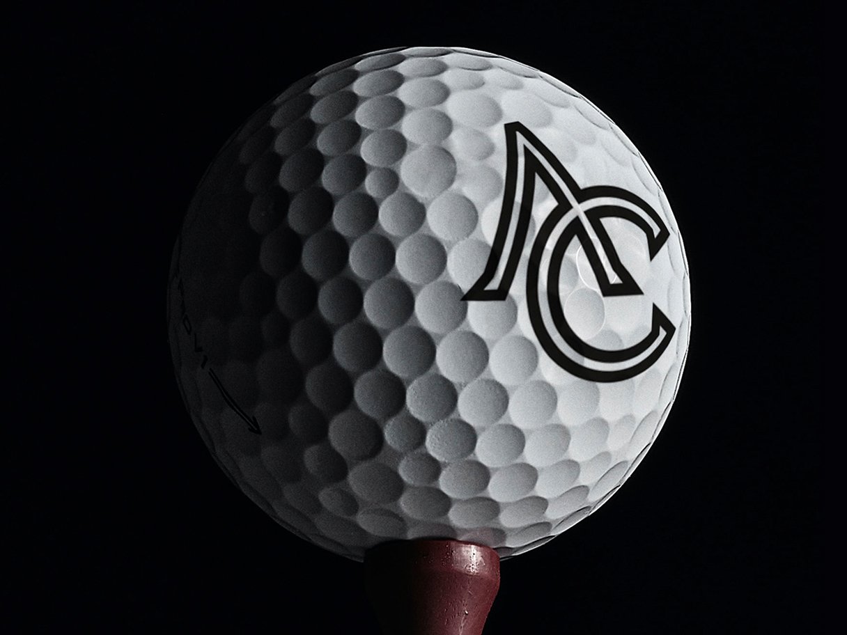 Rustic cabin in a golden field at sunset