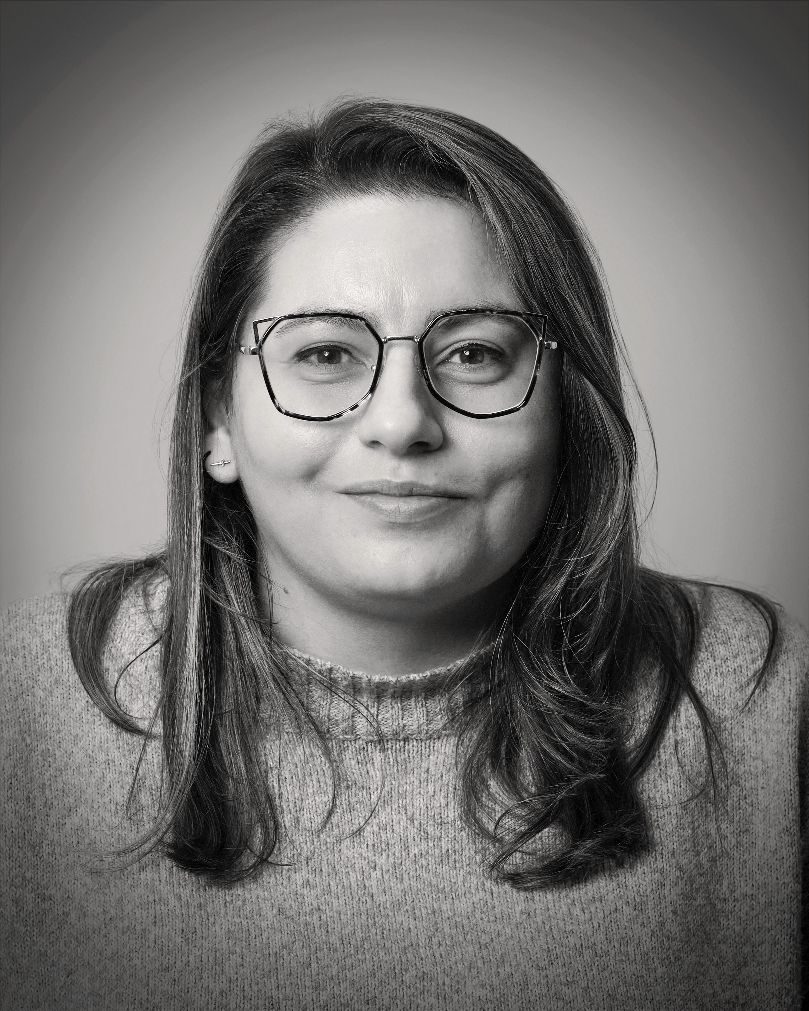 headshot of male in dark background