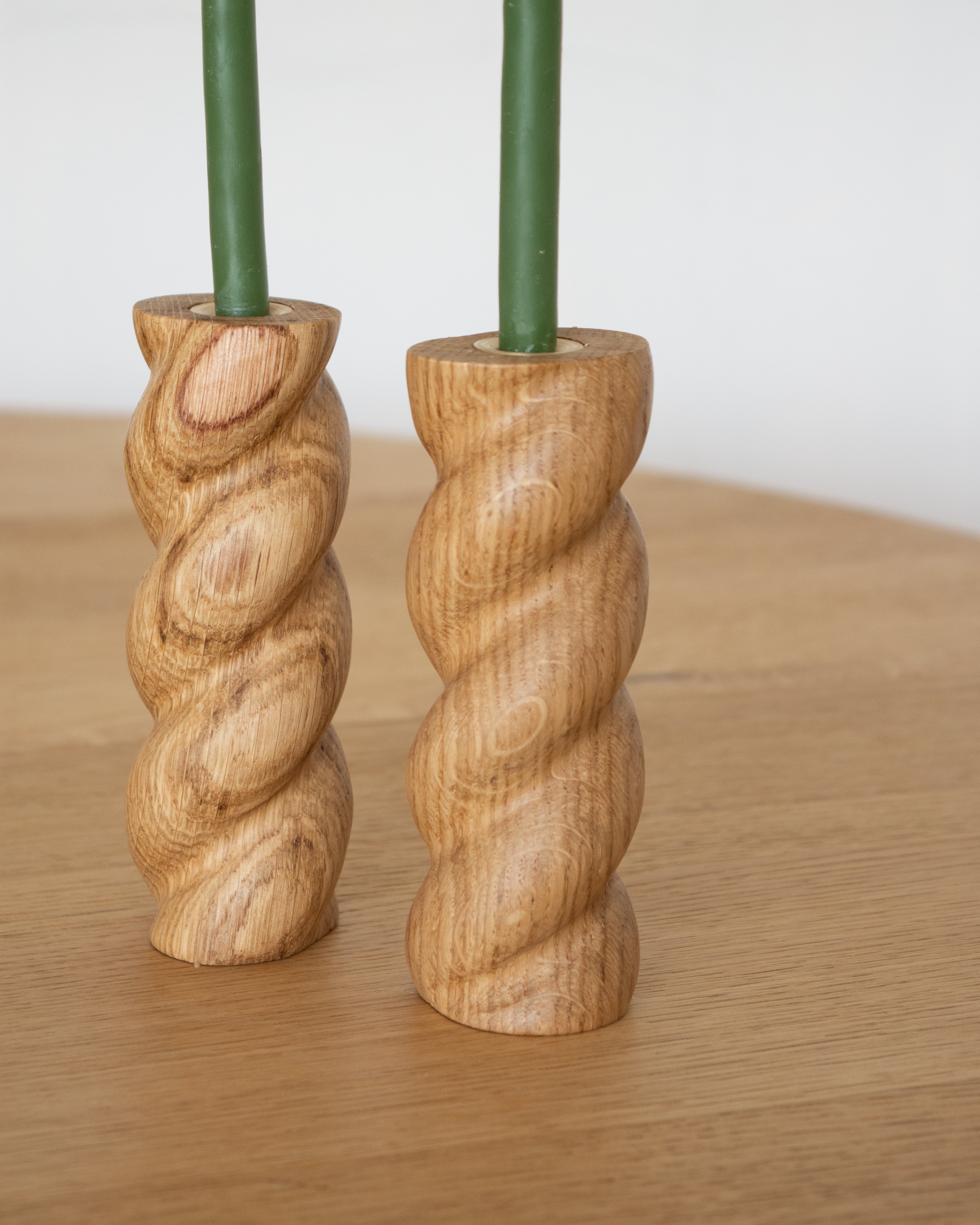 Twisted 99 Candlestick Holder Pair by Wilkinson & Rivera on oak table