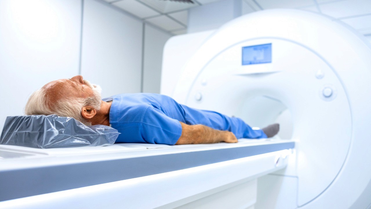 man laying in MRI Machine