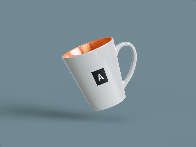 White ceramic mug with an orange interior, floating against a blue background, displaying a black square logo with the letter “A.”