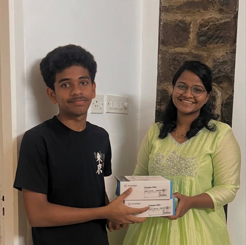 woman in white button up shirt smiling