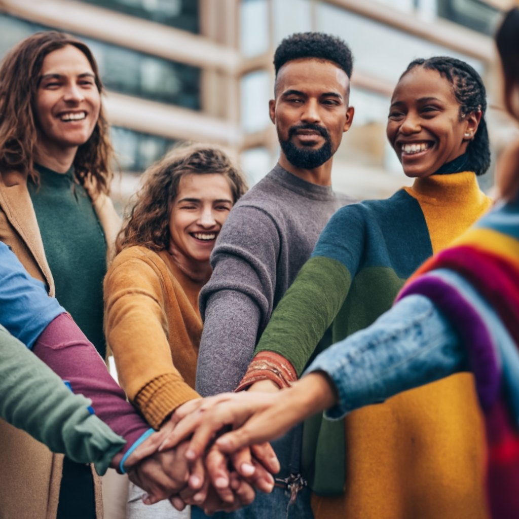  Diverse group of people holding hands, symbolizing unity and understanding