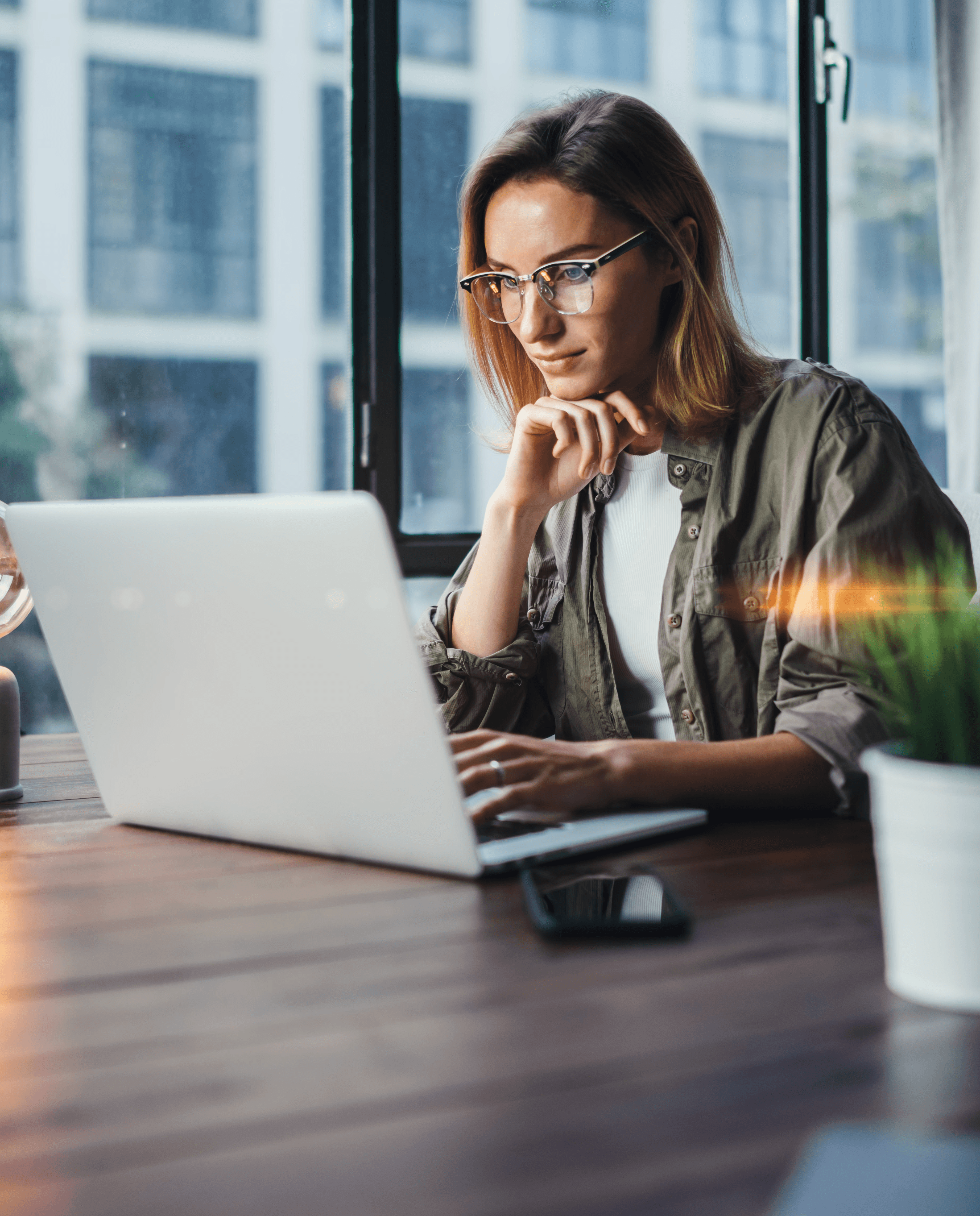 Woman working on laptop in office