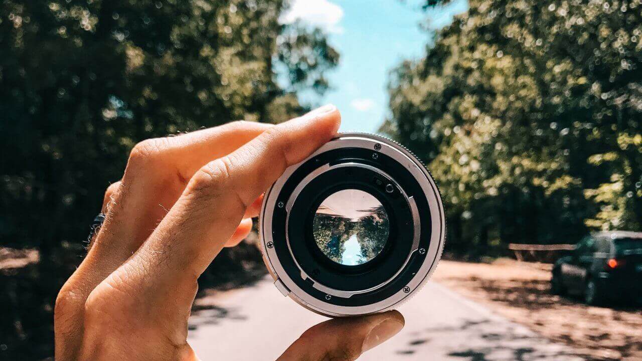 looking through a camera lens in a street