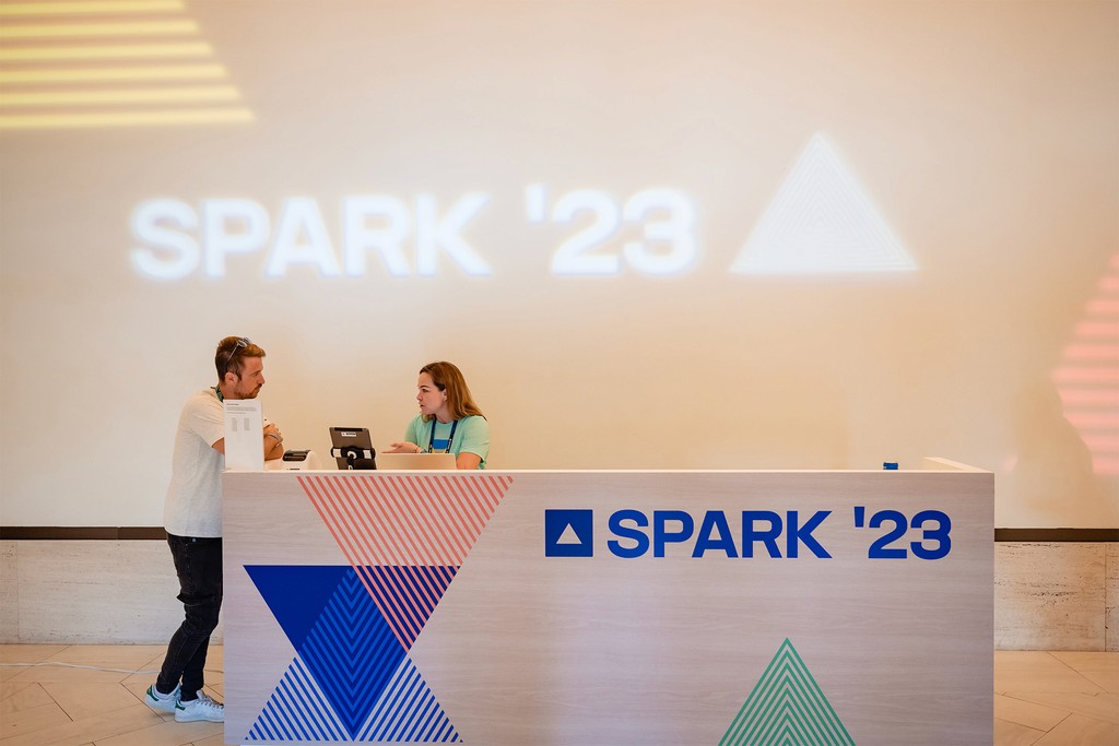 Photo of a help desk in SPARK branding. 