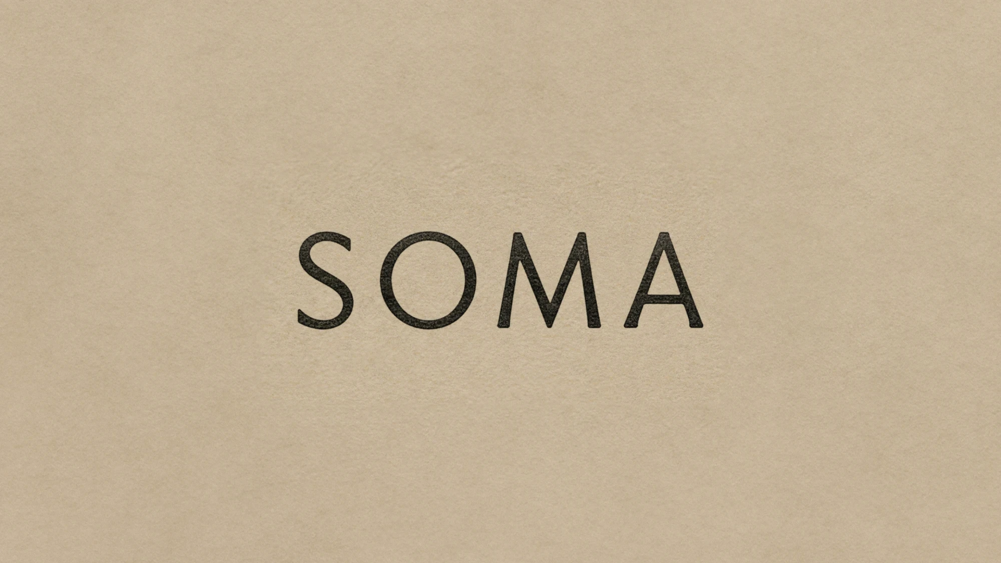 SOMA wordmark on textured paper