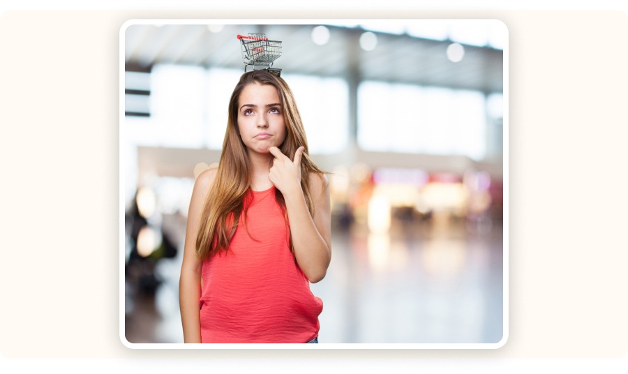 Woman with a small shopping cart on her head