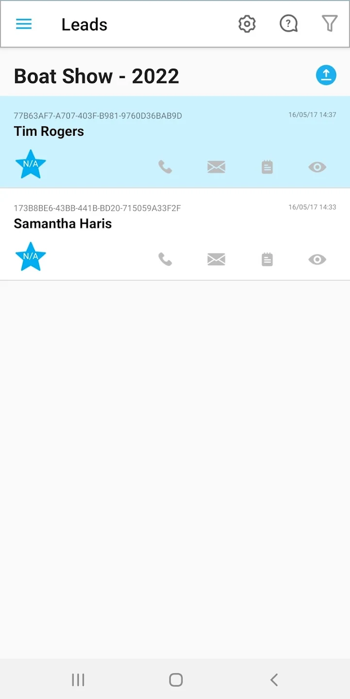 a hand holding a black device