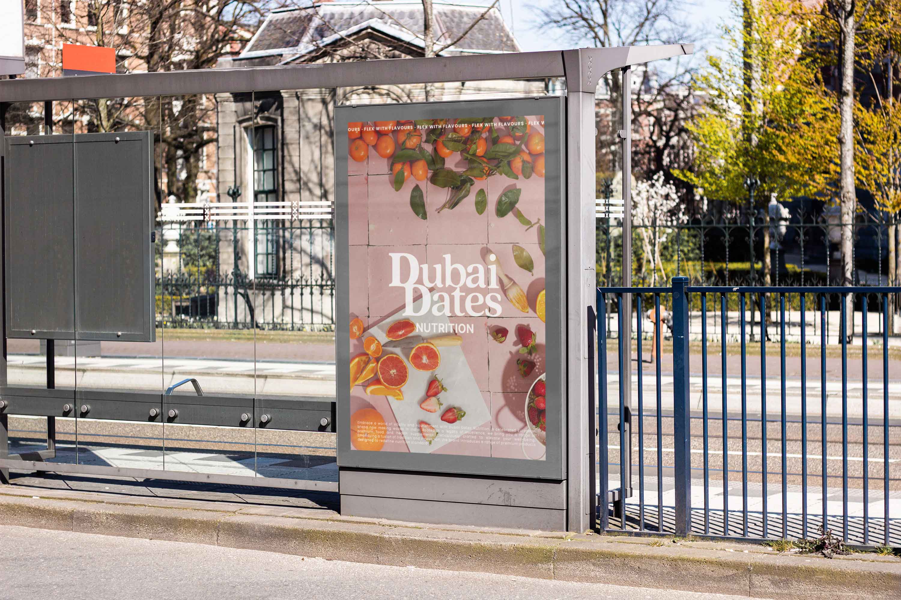 Poster on a bus stop advertising Dubai Dates Nutrition with the white logo in the center surrounded by fresh fruit.