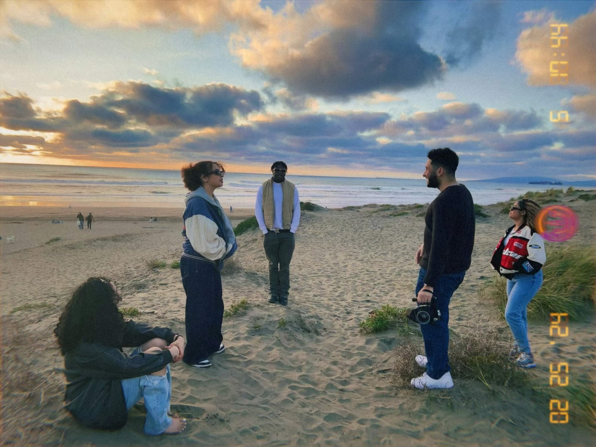 behind the scenes image of twyne doing a video shoot on the beach for a client