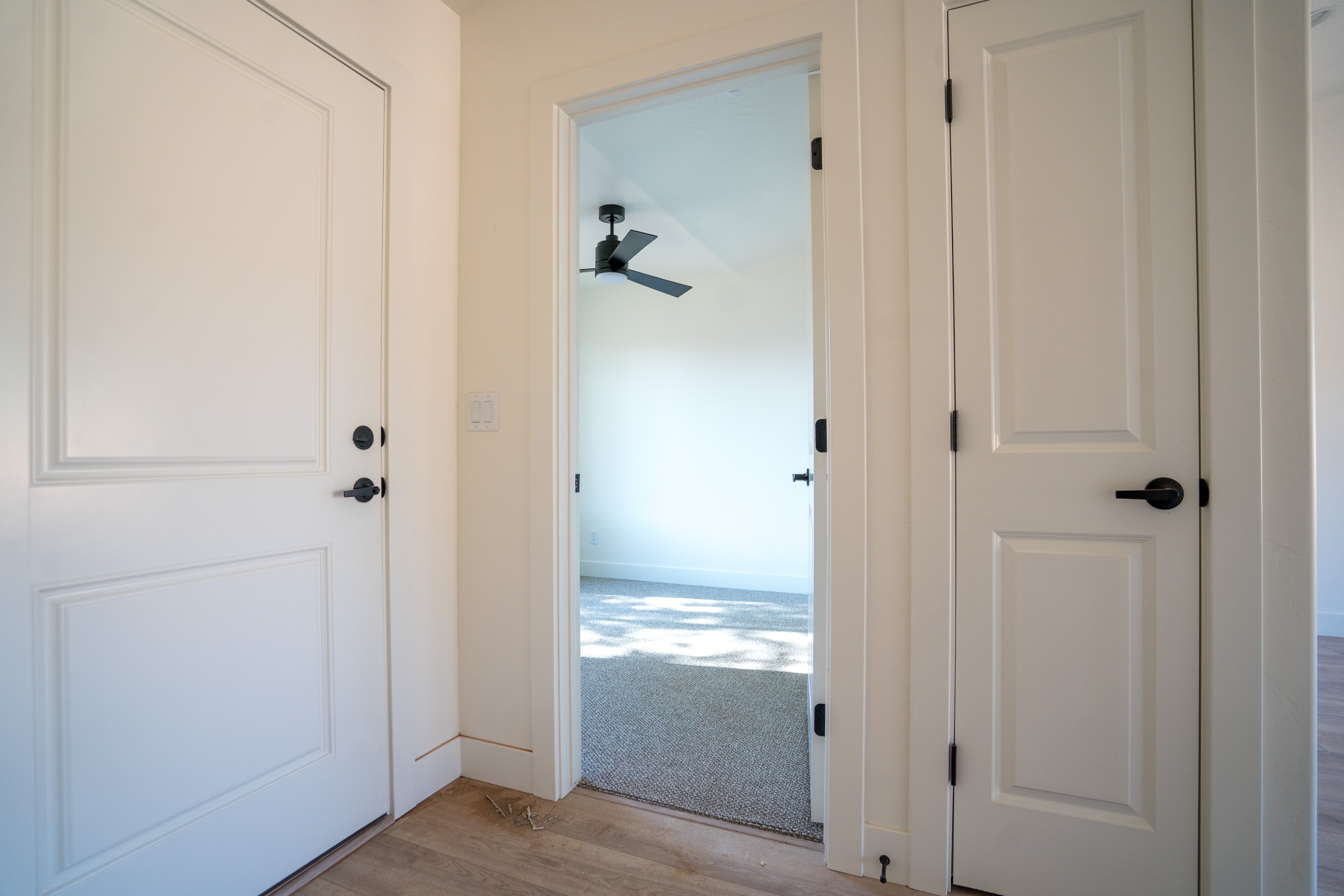 Interior hallway in Southern Utah home remodel leading into bright bedroom space.