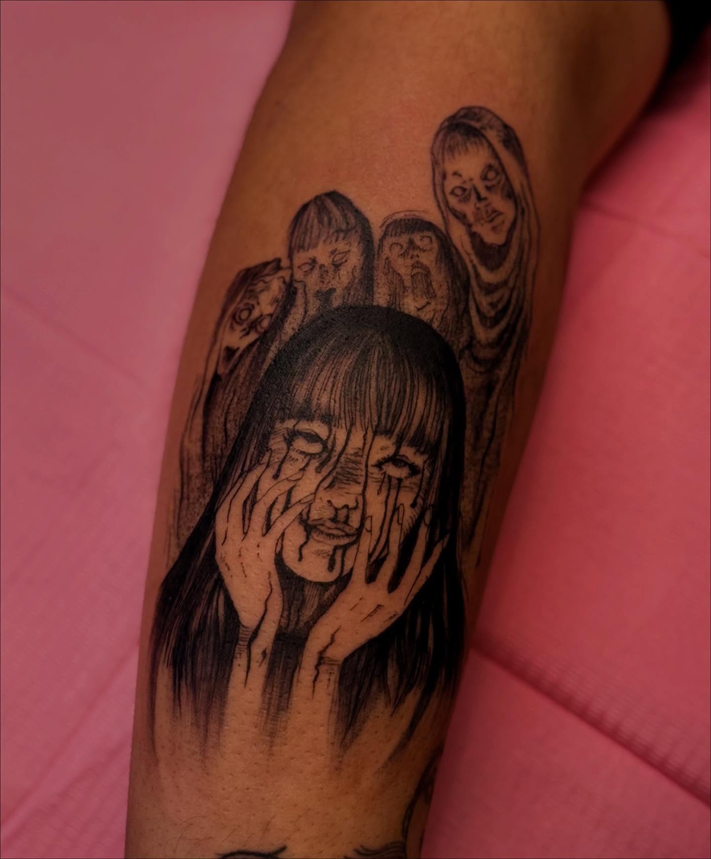 A forearm tattoo of Nezuko Kamado from Demon Slayer, depicted in a stylized anime art style. She is holding a sword.