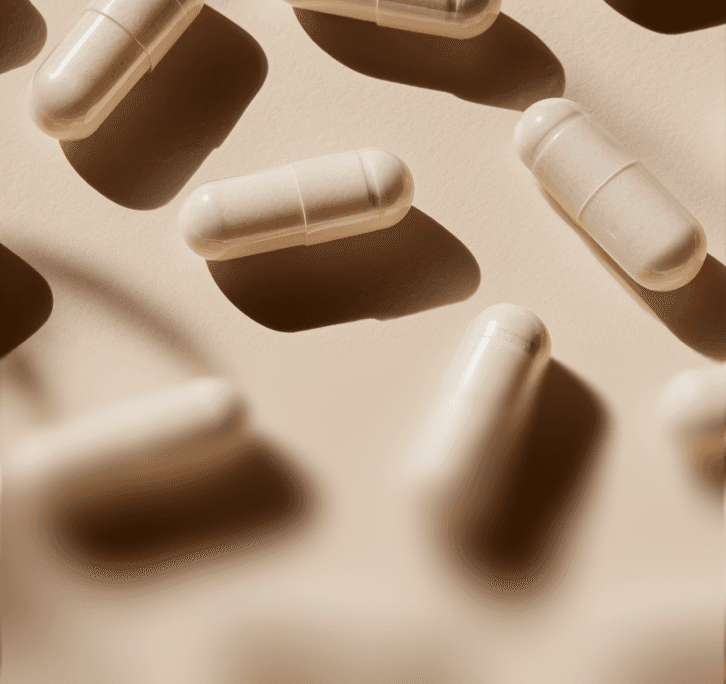 Beige capsules illustrating unseen inefficiencies manufacturers face and how AI helps recover lost time and resources.