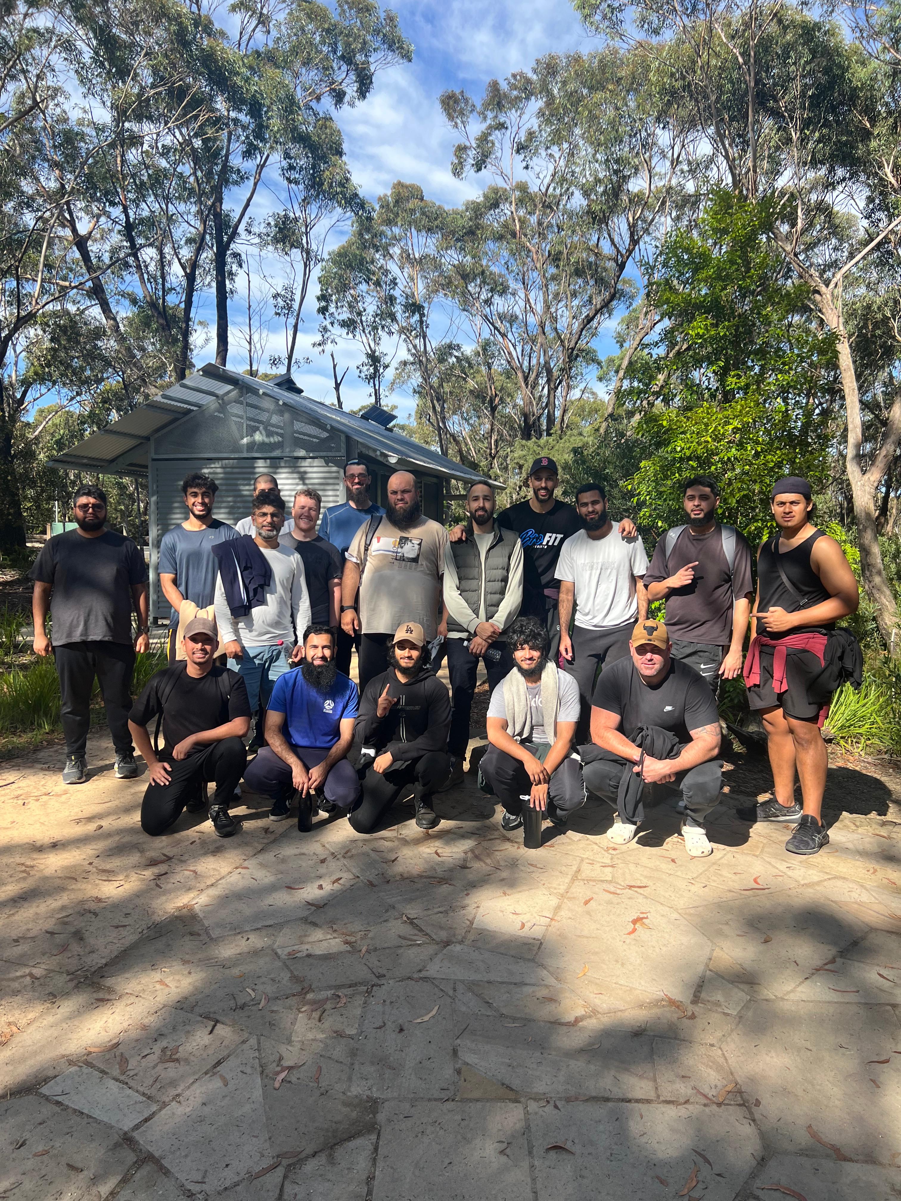 five children smiling while doing peace hand sign