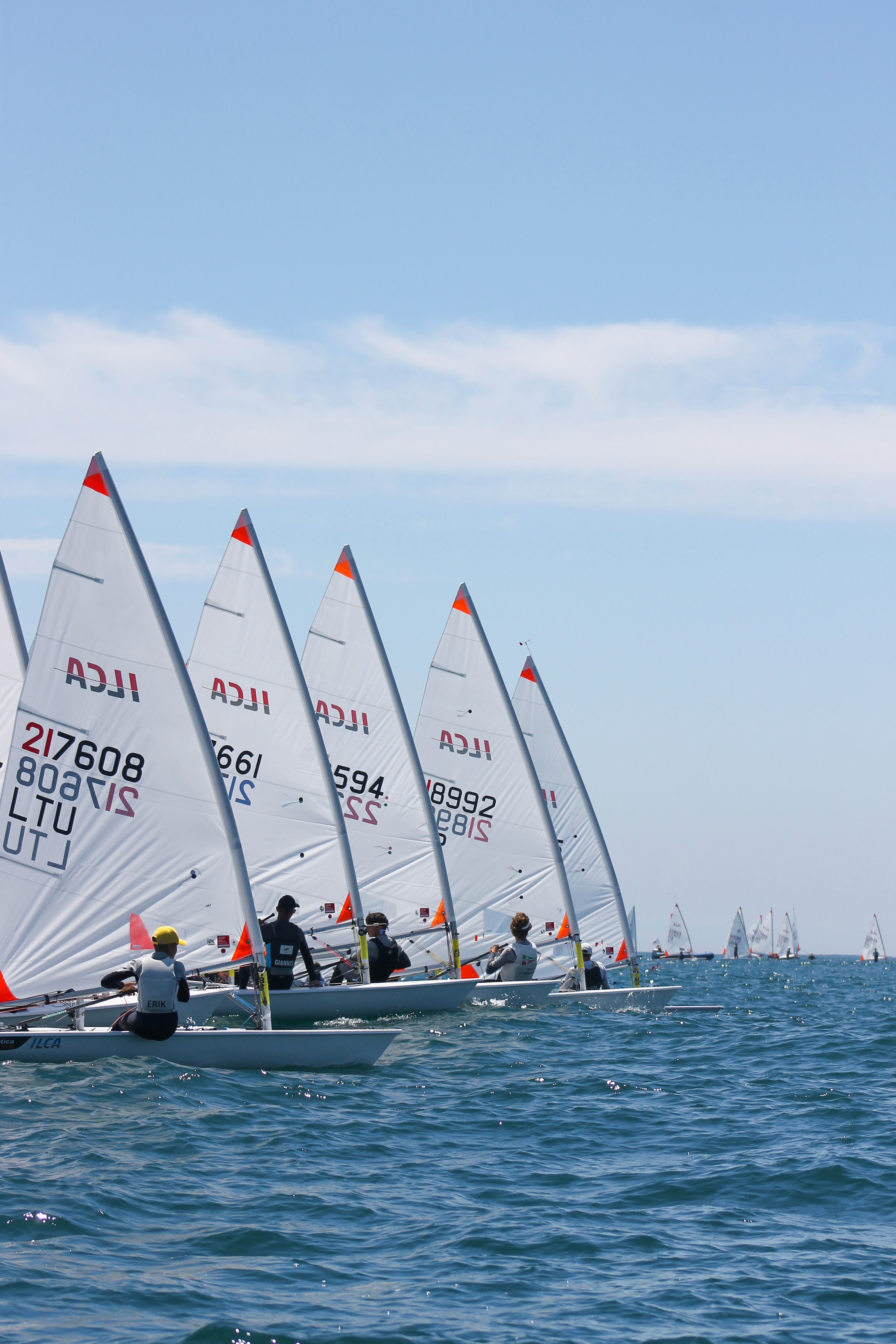 Group of men standing with Sufboard