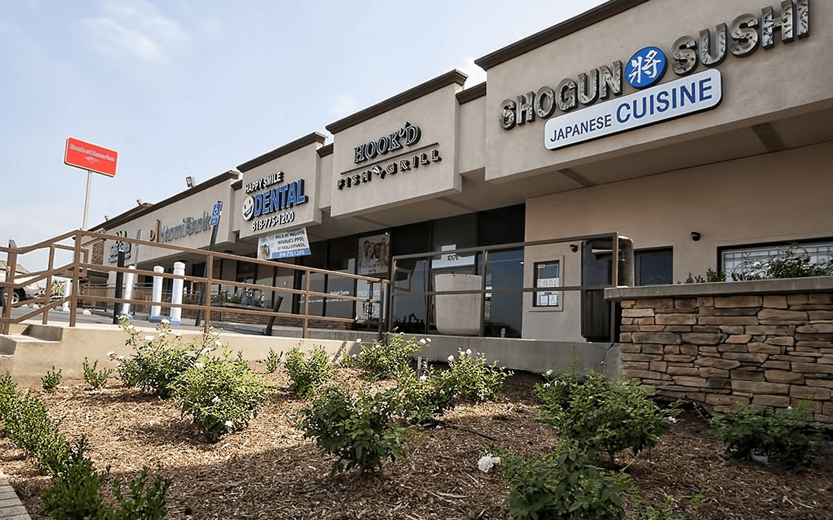 Facade view highlighting the updated, modern design elements and clean lines that enhance the shopping center's curb appeal.