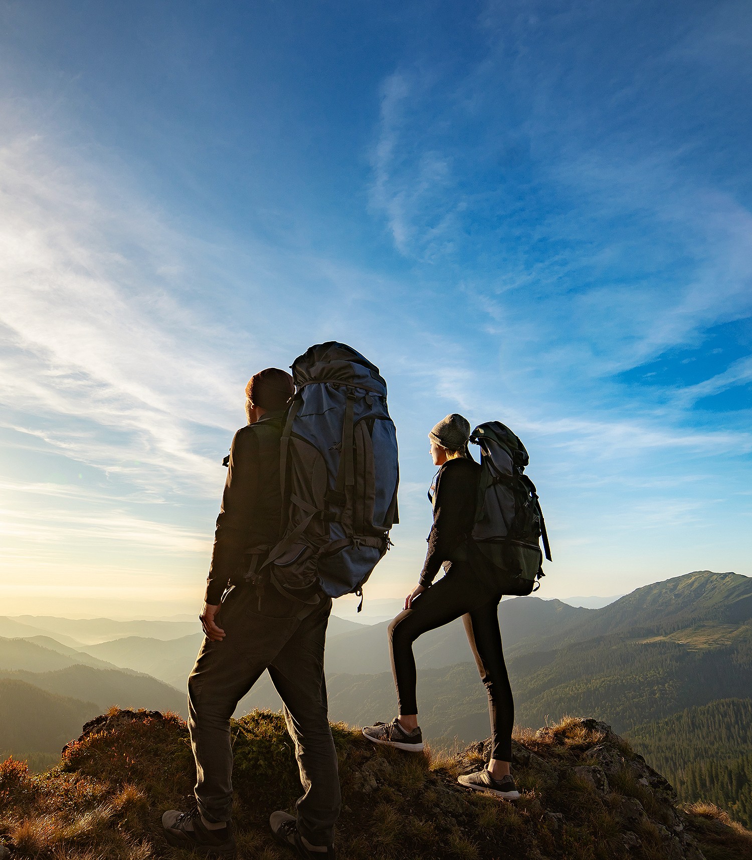 group of people setting up campfire