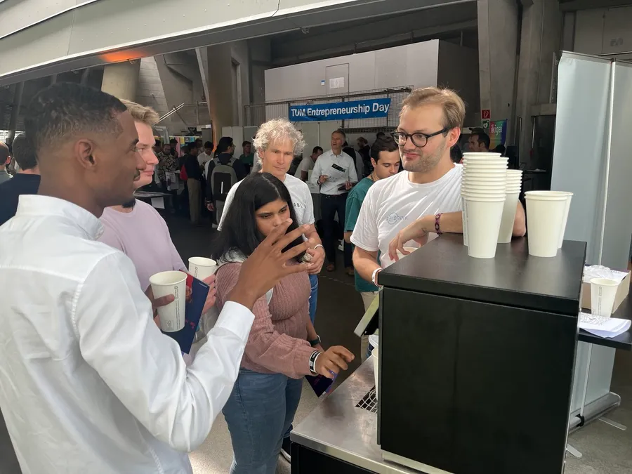 People drinking beverages at the Re:Drink dispenser