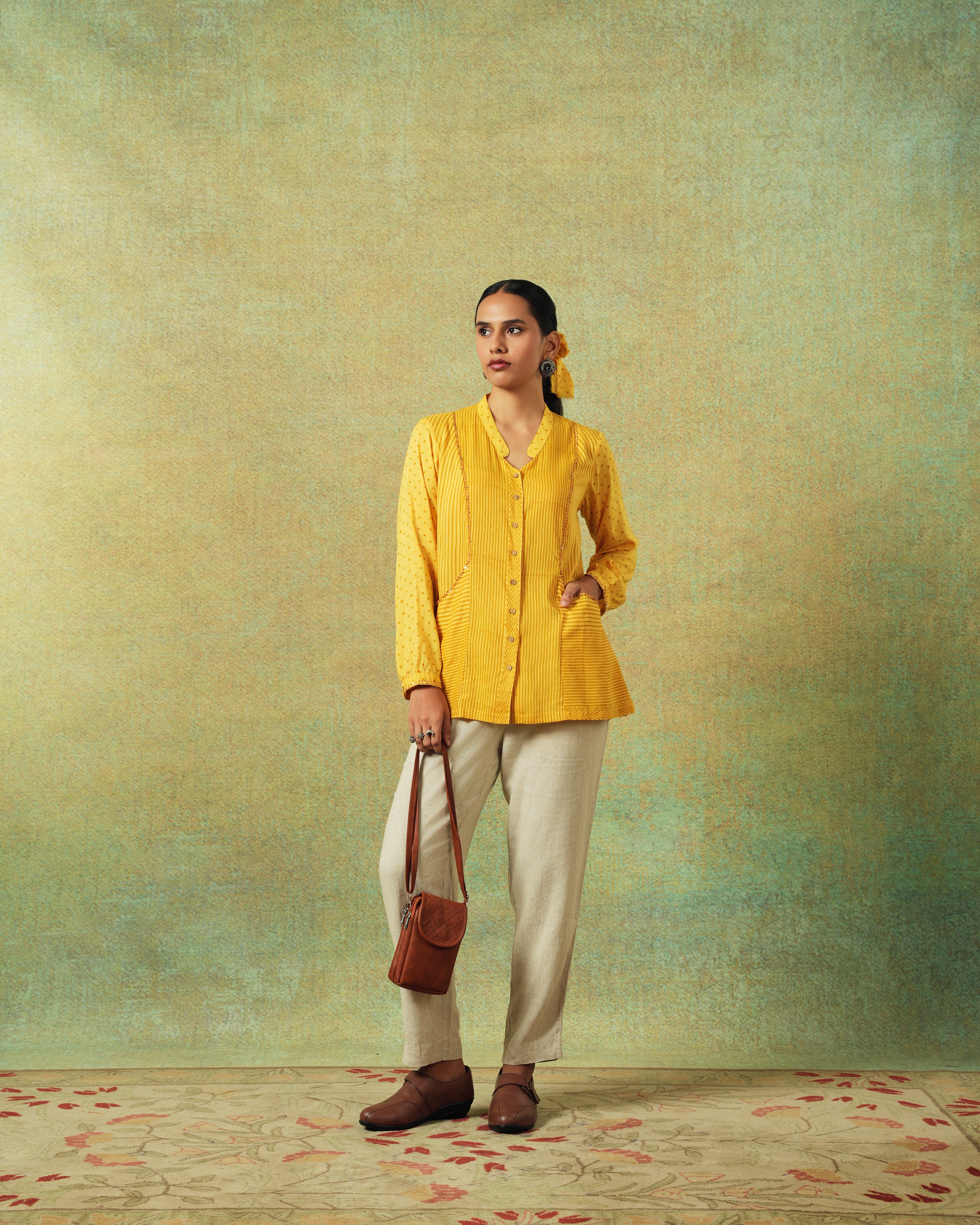 Person sitting on a ledge overlooking New York City skyline